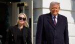 President Donald Trump, accompanied by White House Press Secretary Karoline Leavitt, walks toward the media as he departs on Marine One on the South Lawn of the White House on Feb. 27, 2026, in Washington, D.C.