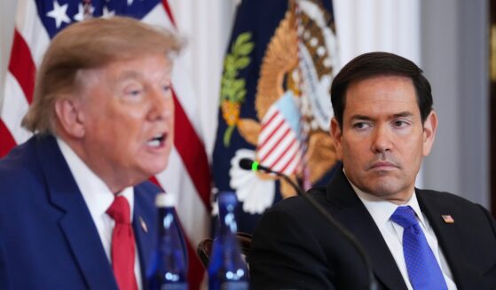 Secretary of State Marco Rubio listens as President Donald Trump speaks during a roundtable on the American mining industry at the Department of State on Aug. 7, 2026, in Washington, D.C.