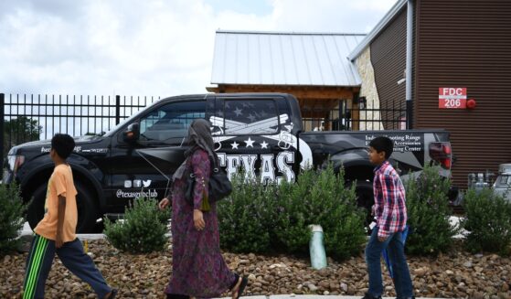 People walk to a Mosque in Stafford, Texas, for the funeral of Santa Fe High School shooting victim Sabika Sheikh, 17, on May, 20, 2018.
