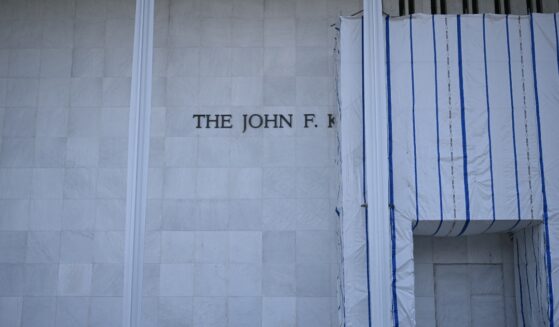 Scaffolding and a large protective tarp is covering part of the facade of the John F. Kennedy Center for the Performing Arts in Washington, D.C., on Aug. 13, 2026.