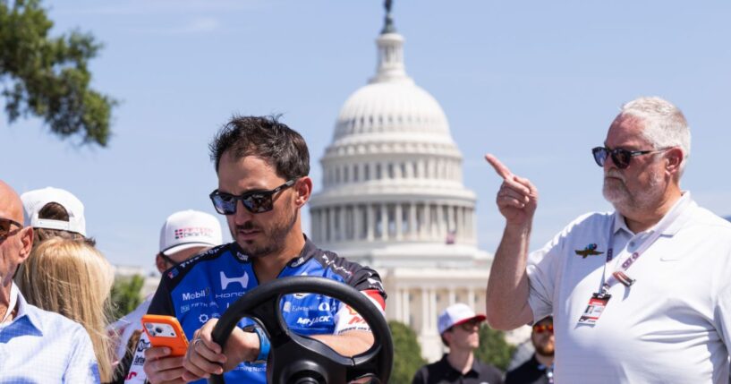 Graham Rahal rides a cart on the Freedom 250 Grand Prix track along the National Mall on Aug. 21, 2026, in Washington, D.C.