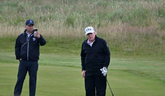 President Donald Trump looks on as he plays golf at the Trump Turnberry Golf Courses, in Turnberry on the southwest coast of Scotland on July 27, 2025, during the third day of his visit to the country, since his second tenure as President began.