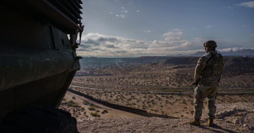 A U.S. Army soldier stands next to a Stryker armored infantry transport vehicle, which has been deployed along the U.S.-Mexico border as part of the military's Joint Task Force Southern Border mission, in Sunland Park, New Mexico, on April 4, 2025.