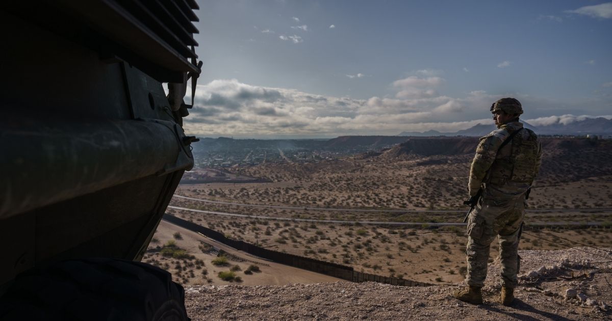 A U.S. Army soldier stands next to a Stryker armored infantry transport vehicle, which has been deployed along the U.S.-Mexico border as part of the military's Joint Task Force Southern Border mission, in Sunland Park, New Mexico, on April 4, 2025.