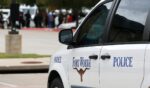 A Fort Worth Police car is parked outside the funeral service for Atatiana Jefferson on Oct. 24, 2019, at Concord Church in Dallas, Texas.