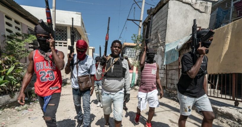 Gang leader Jimmy "Barbecue" Cherizier patrolling the streets with G-9 federation gang members in the Delmas 3 area on Feb. 22, 2024, in Port-au-Prince, Haiti.
