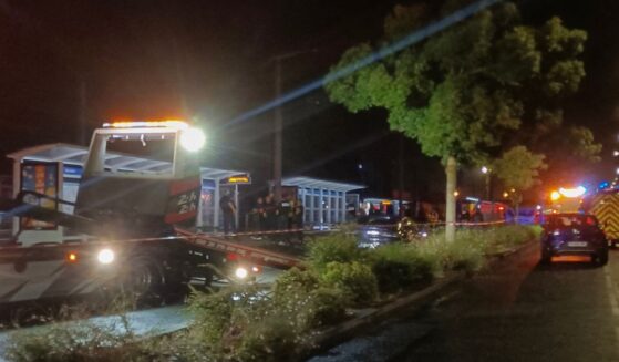 Police officials investigate the scene where a man drove a car into a group of people in the north-western French city of Caen late Wednesday.