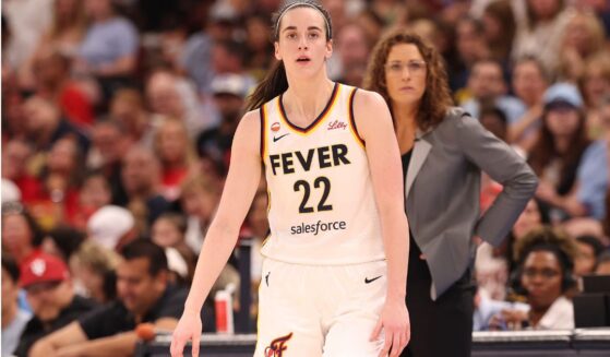 Caitlin Clark #22 of the Indiana Fever is seen with with head coach Stephanie White Saturday during the first half of the game against the Chicago Sky.