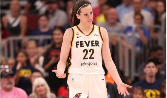 Caitlin Clark #22 of the Indiana Fever reacts against the Chicago Sky during the first half Saturday at United Center in Chicago, Illinois.
