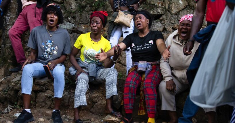 Haitians react in grief following overnight violence where more than 40 people were killed by armed gangs in Kenscoff, a neighborhood near Port-au-Prince, Haiti.