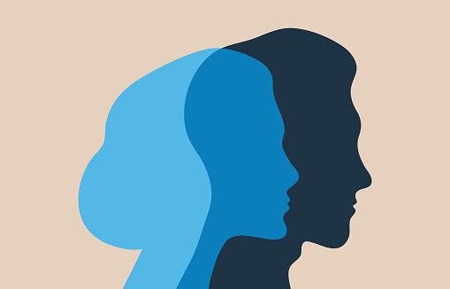 A silhouette of a woman and a man is pictured.