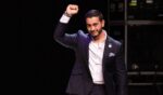 Abdul El-Sayed pumps his fist in the air at a campaign rally on August 4, 2026.