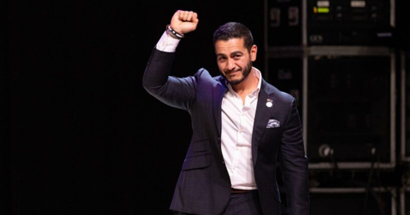 Abdul El-Sayed pumps his fist in the air at a campaign rally on August 4, 2026.