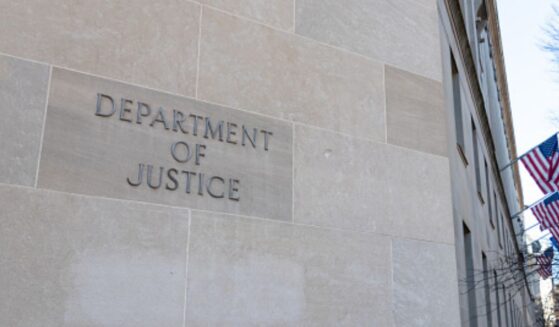 The DoJ Building is pictured on a bright sunny day.