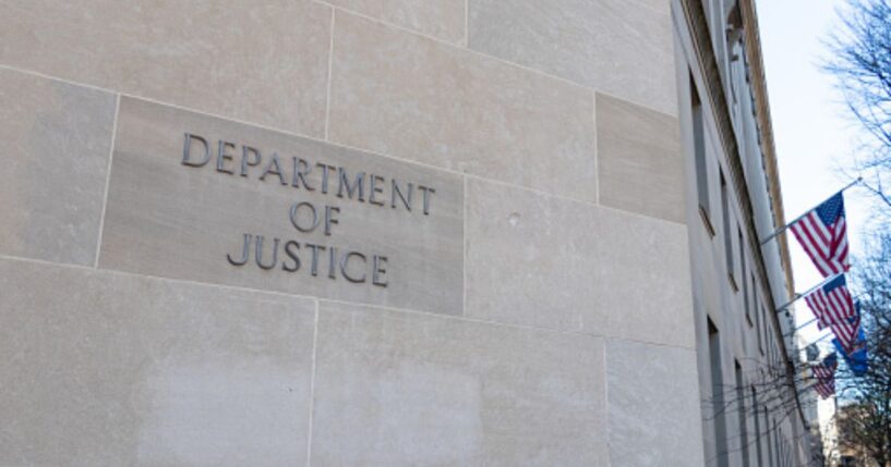 The DoJ Building is pictured on a bright sunny day.