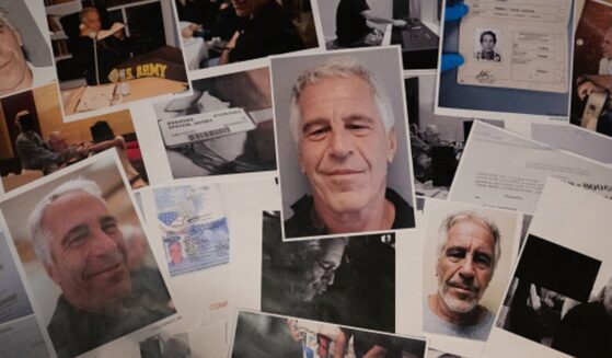 Pictures of Epstein are scrambled upon a wooden table.