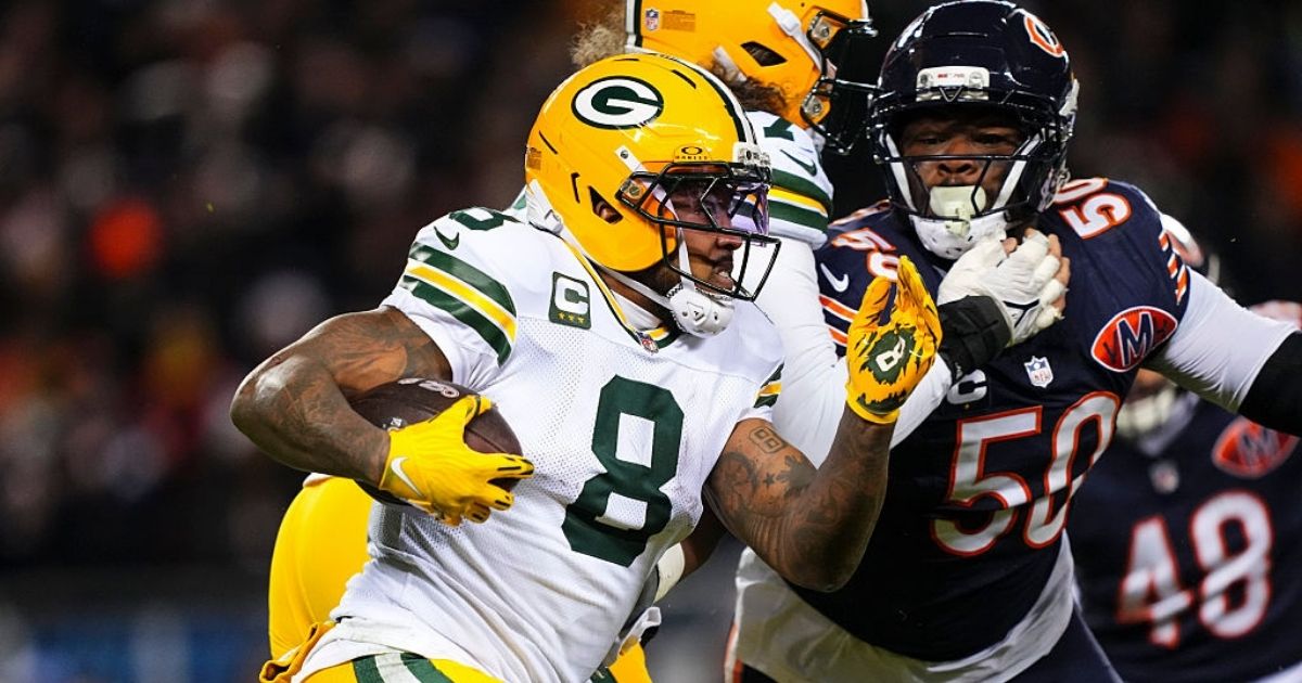 Josh Jacobs #8 of the Green Bay Packers runs the ball during an NFC Wild Card Playoff game against the Chicago Bears at Soldier Field on Jan. 10 in Chicago, Illinois.