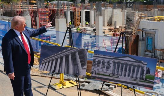 President Donald Trump speaks and points at the construction site of his newly proposed White House ballroom at the White House in Washington on May 19, 2026.