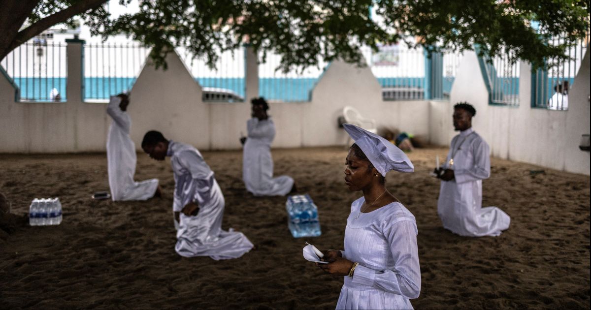 Christian worshippers pray at the Celestial Church of Christ international headquarters in Lagos, Nigeria on July 12, 2026.