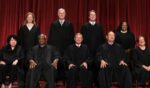 The justices of the United States Supreme Court pose for a photograph in Washington on Oct. 7, 2022.