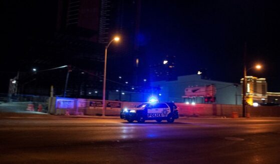 A police car makes it way to the scene of shooting in downtown Las Vegas on June 1, 2020.