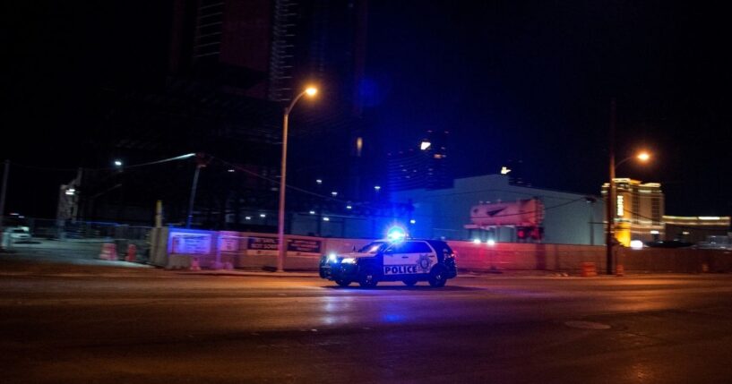 A police car makes it way to the scene of shooting in downtown Las Vegas on June 1, 2020.