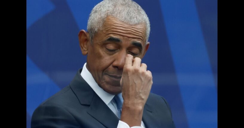 Former U.S. President Barack Obama listens to Michelle Obama's speech at the Barack Obama Presidential Center in John Lewis Plaza on June 18, 2026 in Chicago.