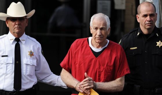 Former Penn State assistant football coach Jerry Sandusky leaves the Centre County Courthouse after being sentenced in his child sex abuse case on Oct. 9, 2012, in Bellefonte, Pennsylvania.