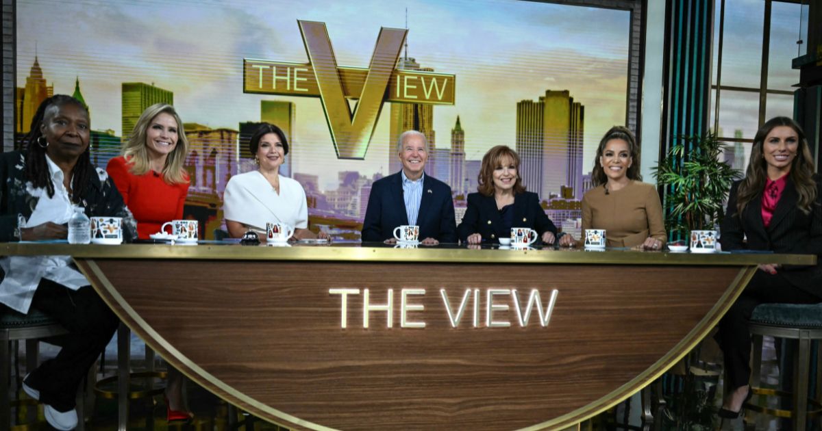 Then-President Joe Biden, center, attended a live interview on ABC's "The View" in New York on Sept. 25, 2024. The hosts, from left, are Whoopi Goldberg, Sara Haines, Ana Navarro, Joy Behar, Sunny Hostin, and Alyssa Farah Griffin.