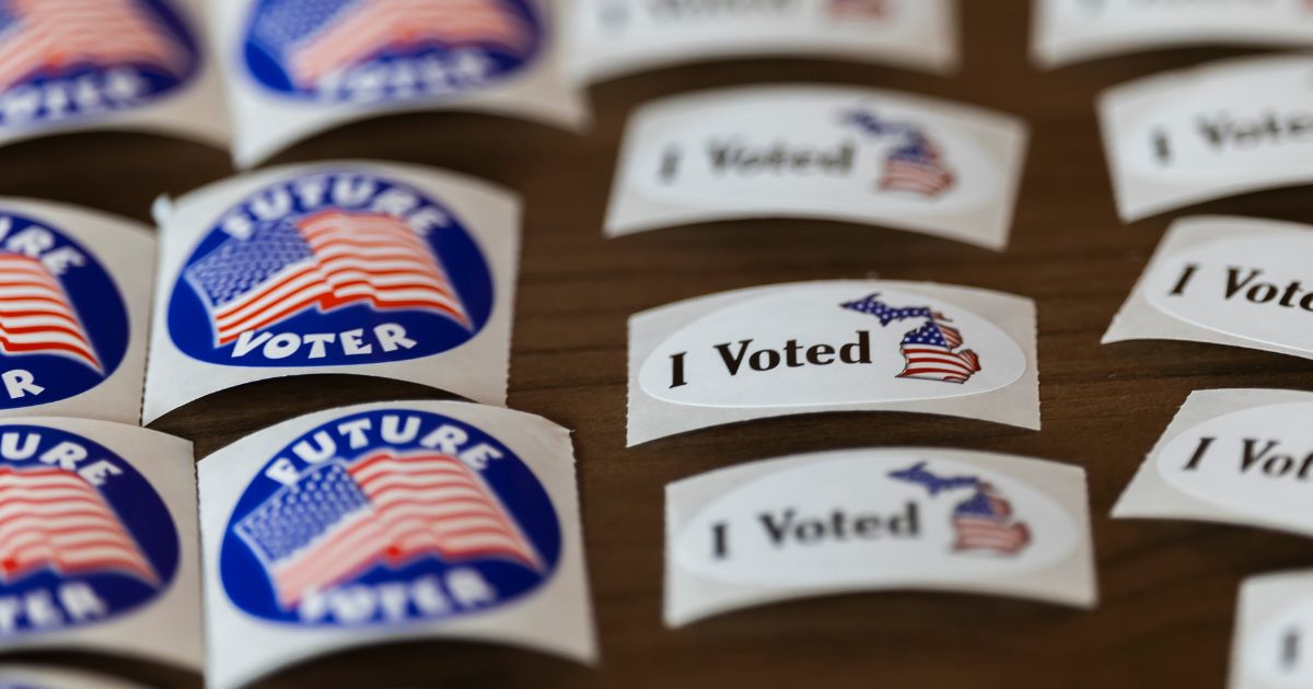 Voting stickers are displayed at a polling place in Michigan Tuesday.