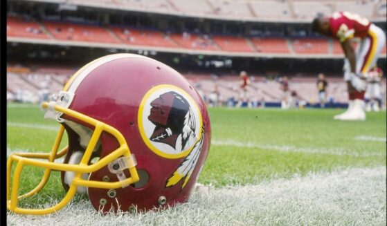 A Washington Redskins helmet lies on the field Nov. 21, 1993, during a game against the Los Angeles Rams at Anaheim Stadium in Anaheim, California. The Rams won the game, 10-6.