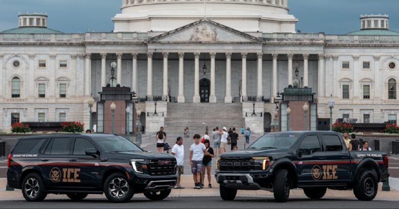 Immigration and Customs Enforcement vehicles are pictured in an August 2025 file photo outside the U.S. Capitol.