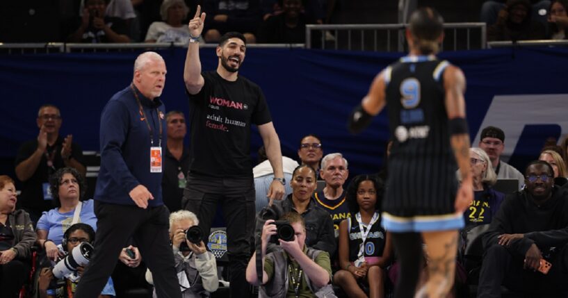 Former NBA player Enes Kanter Freedom gets in a dispute on Sunday with the the Chicago Sky's Natasha Cloud during a Sky-Indiana Fever WNBA game at Chicago's Wintrust Arena.