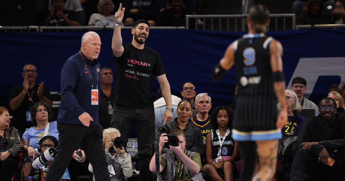 Former NBA player Enes Kanter Freedom gets in a dispute on Sunday with the the Chicago Sky's Natasha Cloud during a Sky-Indiana Fever WNBA game at Chicago's Wintrust Arena.
