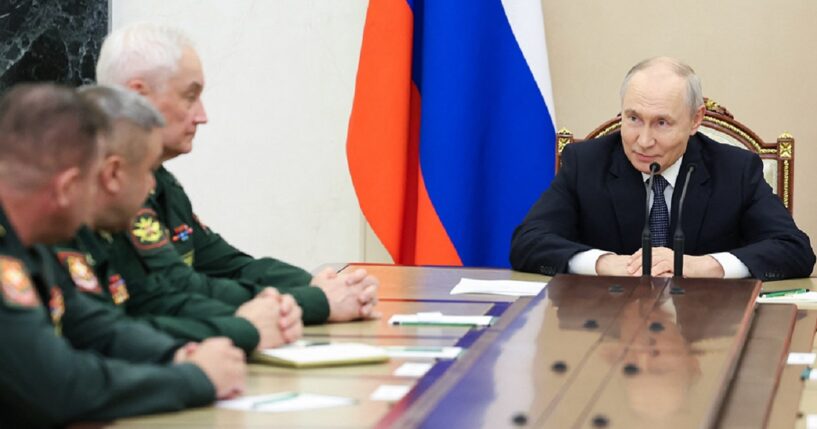 Russian President Vladimir Putin meets with Russian Defense Ministry leadership Wednesday in a photo distributed by the Russian state agency Sputnik.