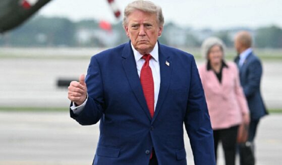 President Donald Trump, pictured flashing a thumbs up in an Aug. 11 file photo at Cleveland's Cleveland Hopkins International Airport.