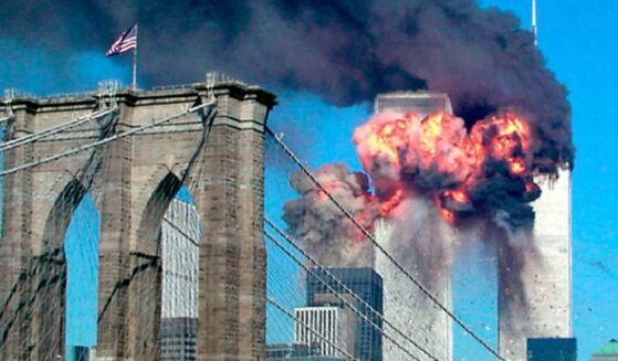 The Twin Towers of the World Trade Center burn before collapsing in the terror attacks of 9/11.