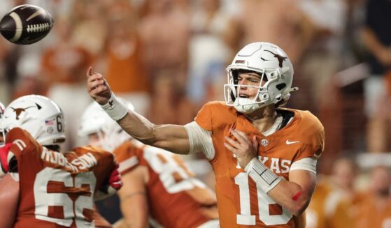 Arch Manning #16 of the Texas Longhorns passes the ball against the Ohio State Buckeyes Saturday during the third quarter at Darrell K Royal-Texas Memorial Stadium in Austin, Texas.