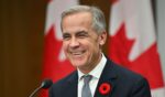 Canadian Prime Minister Mark Carney smiles during a press conference after the 2025 Asia-Pacific Economic Cooperation Economic Leaders' Meeting in Gyeongju on Nov. 1, 2025.