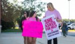 Supporters of Lindsay Clancy hold signs outside the Plymouth County Superior Court during Lindsay Clancy's murder trial in Plymouth, Massachusetts, on Aug. 26, 2026.