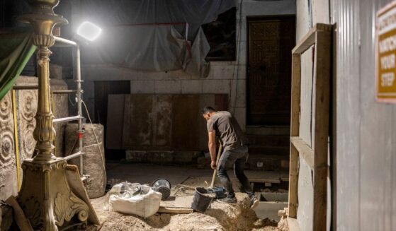 A worker carries out renovations at the Church of the Holy Sepulchre in the old city of Jerusalem on Aug. 4, 2026.
