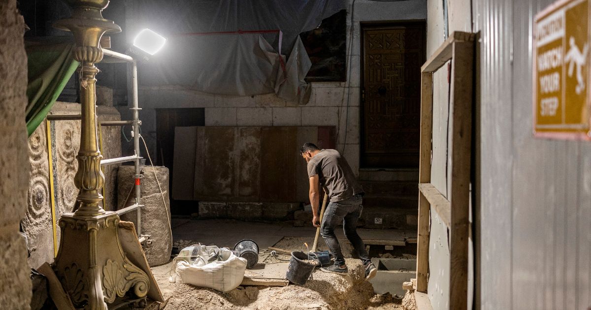 A worker carries out renovations at the Church of the Holy Sepulchre in the old city of Jerusalem on Aug. 4, 2026.