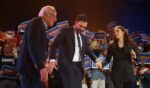 New York Mayor Zohran Mamdani salutes with Sen. Bernie Sanders and Rep. Alexandria Ocasio-Cortez during an election rally at Forest Hills Stadium on Oct. 26, 2025, in the Queens borough of New York City.