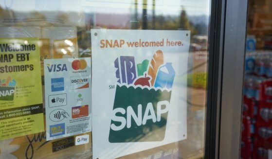 A "SNAP Welcomed Here" sign is seen at the entrance to a Big Lots store in Portland, Oregon, on Oct. 28, 2020.