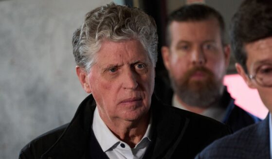 Rhode Island Gov. Daniel McKee looks on during a press conference near the campus of Brown University in Providence, Rhode Island, on Dec. 14, 2025.