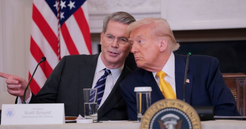 Treasury Secretary Scott Bessent and President Donald Trump look on during the White House Digital Assets Summit in the State Dining Room of the White House on March 7, 2025, in Washington, D.C.