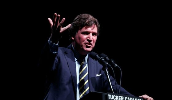 Tucker Carlson speaks at his Live Tour at the Desert Diamond Arena on Oct. 31, 2024, in Phoenix, Arizona.