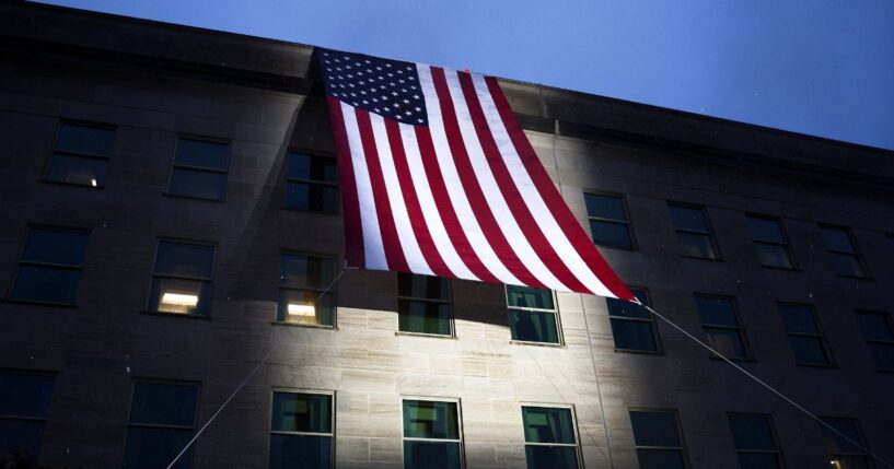 An American flag is unfurled on the side of the Pentagon to mark the 25th anniversary of 9/11 on Sept. 11, 2026, in Arlington, Virginia.