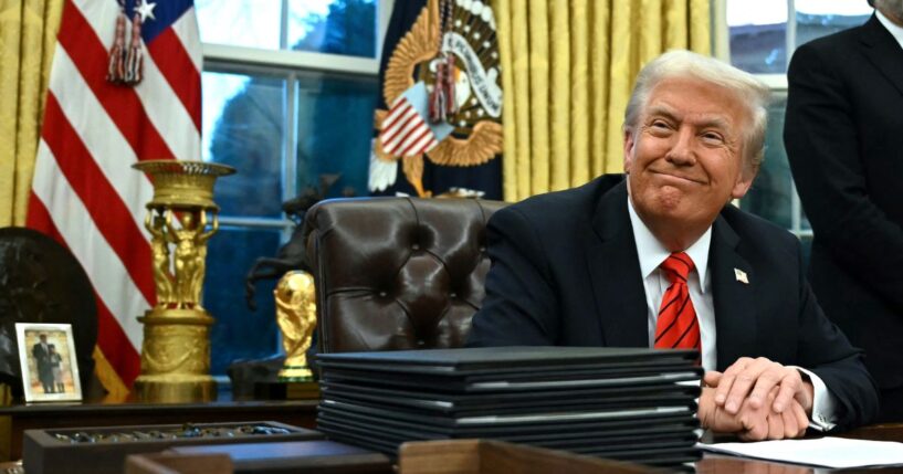 President Donald Trump smiles after signing an executive order in the Oval Office of the White House in Washington, D.C., on Feb. 10, 2025.