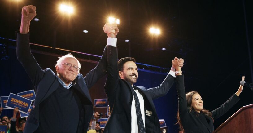 New York Mayor Zohran Mamdani celebrates with Sen. Bernie Sanders and Rep. Alexandria Ocasio-Cortez during an election rally on Oct. 26, 2025, at Forest Hills Stadium in the Queens borough of New York City.